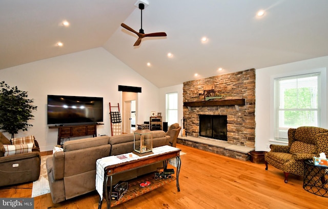 130 Schultz Rd, Sellersville, PA 18960 - living area featuring ceiling fan, vaulted ceiling, healthy amount of natural light, wood finished floors, and a stone fireplace