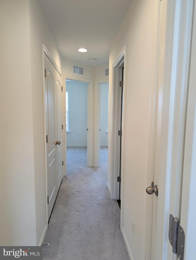 corridor with carpet, baseboards, and recessed lighting