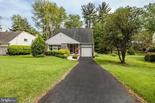 view of front of property featuring an attached garage, asphalt driveway, stone siding, and a front lawn