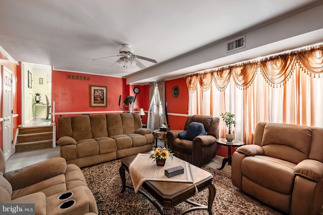 living area featuring ceiling fan and carpet floors