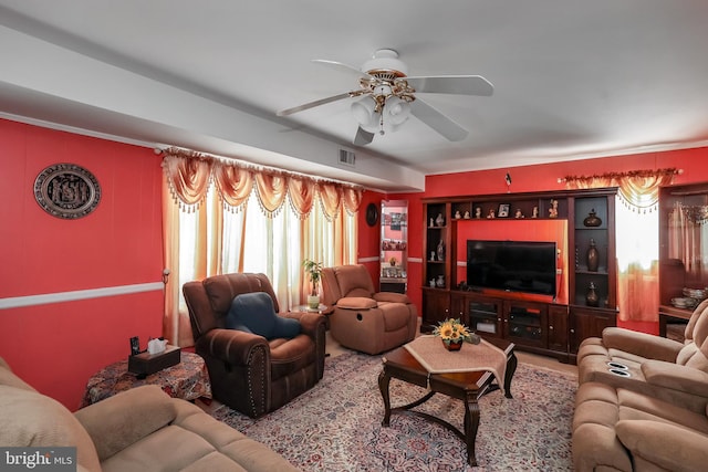 living room with healthy amount of natural light and a ceiling fan
