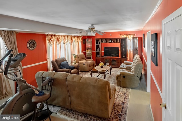 living area with a ceiling fan