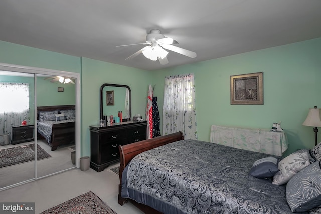 bedroom featuring a closet, a ceiling fan, and carpet
