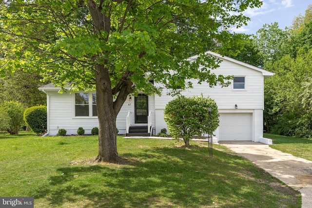 view of property hidden behind natural elements featuring an attached garage, concrete driveway, and a front yard