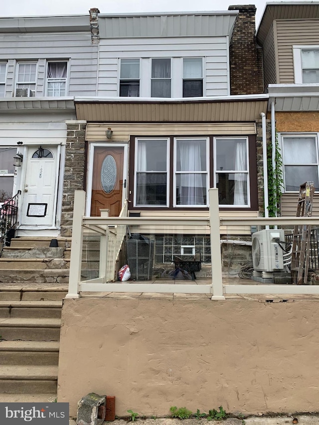4808 Gransback St, Philadelphia, PA 19120 - rear view of house featuring a cooling unit and stone siding