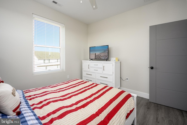 1308 E Bay Ave, Manahawkin, NJ 08050 - bedroom featuring dark wood-style floors, multiple windows, baseboards, and ceiling fan
