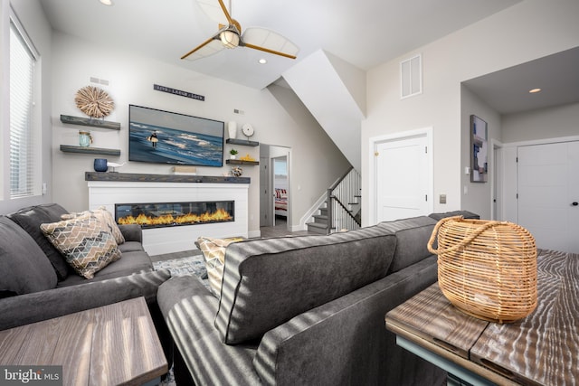 1308 E Bay Ave, Manahawkin, NJ 08050 - living area featuring stairs, a glass covered fireplace, and recessed lighting