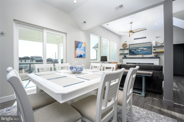 1308 E Bay Ave, Manahawkin, NJ 08050 - dining space featuring vaulted ceiling, wood finished floors, a ceiling fan, and a fireplace