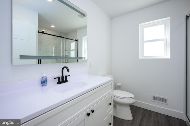 1308 E Bay Ave, Manahawkin, NJ 08050 - bathroom with a shower stall, toilet, vanity, wood finished floors, and baseboards