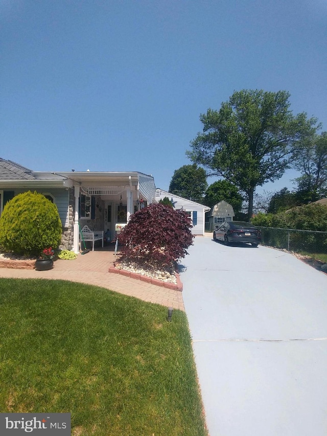 214 Alden Ave, Morrisville, PA 19067 - view of home's exterior featuring driveway and stone siding