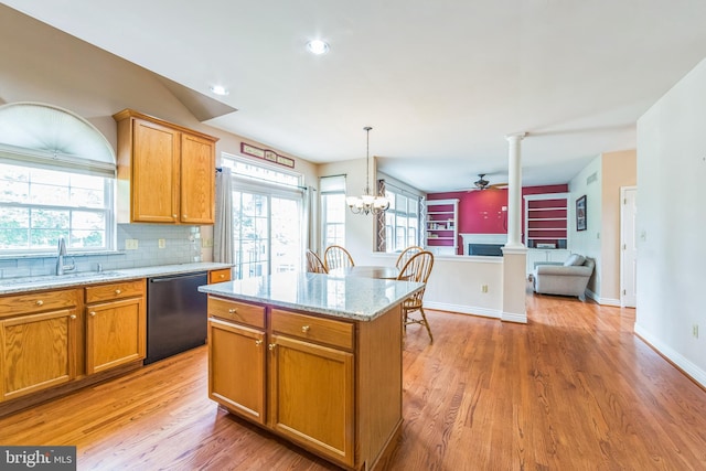 kitchen with dishwasher, a sink, light wood finished floors, ceiling fan, and recessed lighting