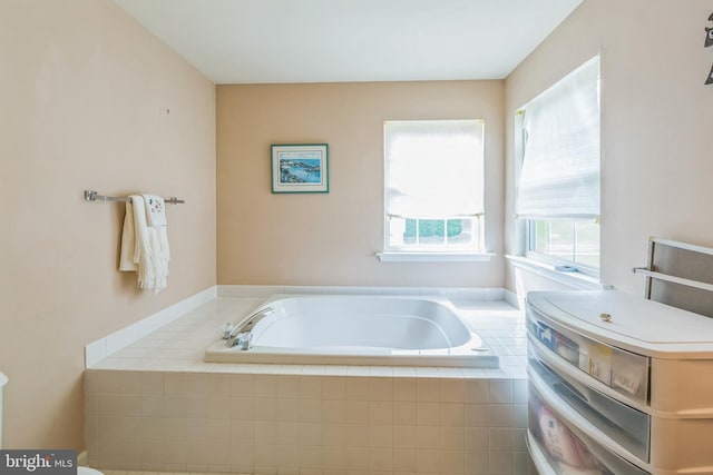 full bathroom with a bath