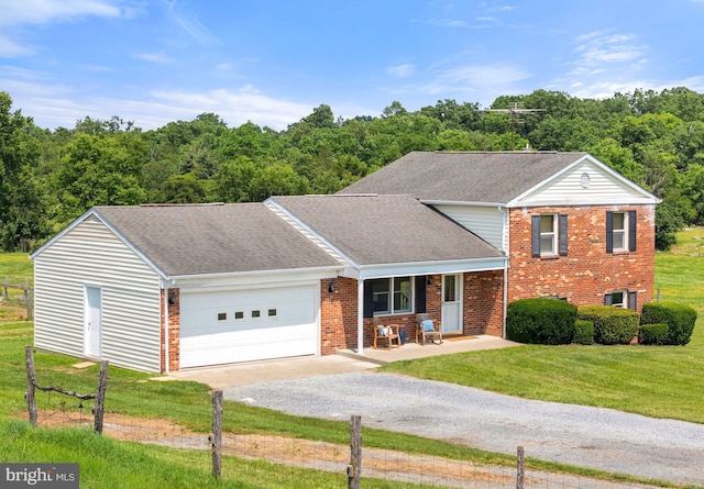 190 Chrismore Rd, White Post, VA 22663 - view of front of home with gravel driveway, brick siding, a porch, a front yard, and an attached garage