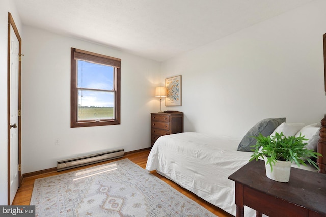 190 Chrismore Rd, White Post, VA 22663 - bedroom with a baseboard radiator and light wood-style flooring