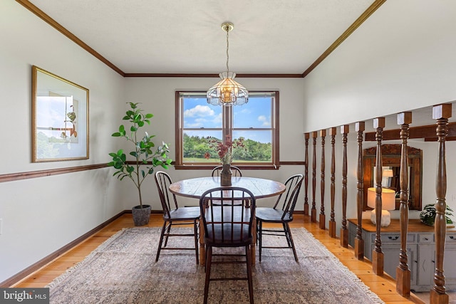 190 Chrismore Rd, White Post, VA 22663 - dining room featuring a chandelier, light wood-style flooring, and ornamental molding