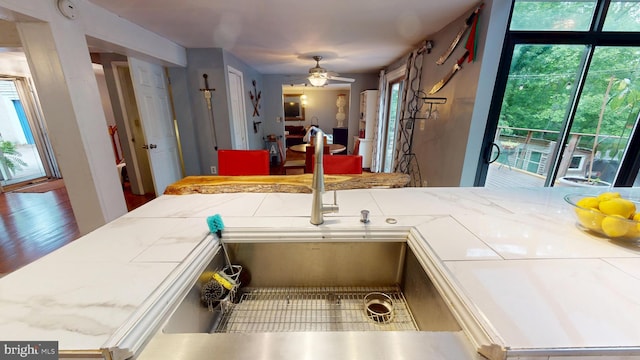 8609 N Dr, Clinton, MD 20735 - kitchen featuring a ceiling fan, tile countertops, and a sink