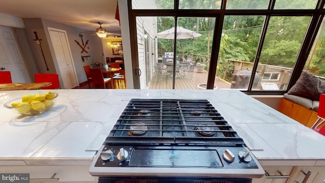 8609 N Dr, Clinton, MD 20735 - kitchen with plenty of natural light, ceiling fan, and tile countertops