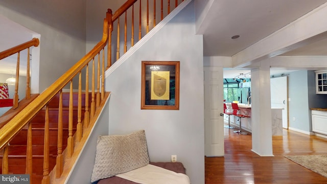 8609 N Dr, Clinton, MD 20735 - stairs with wood finished floors and a barn door