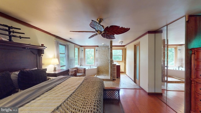 8609 N Dr, Clinton, MD 20735 - bedroom featuring hardwood / wood-style floors, baseboards, and crown molding