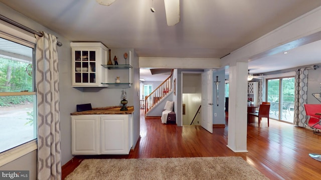 8609 N Dr, Clinton, MD 20735 - kitchen featuring ceiling fan, wood finished floors, and white cabinetry