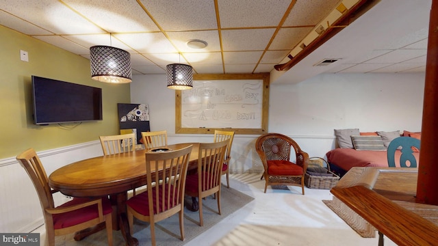 8609 N Dr, Clinton, MD 20735 - dining area featuring a paneled ceiling, carpet, and a wainscoted wall