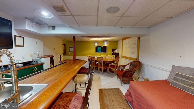 8609 N Dr, Clinton, MD 20735 - interior space with a paneled ceiling, wainscoting, bar area, and carpet