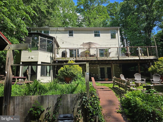 8609 N Dr, Clinton, MD 20735 - rear view of house featuring french doors, a deck, and a sunroom