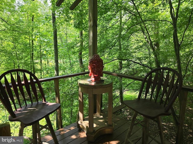 8609 N Dr, Clinton, MD 20735 - view of wooden balcony with a deck and a wooded view