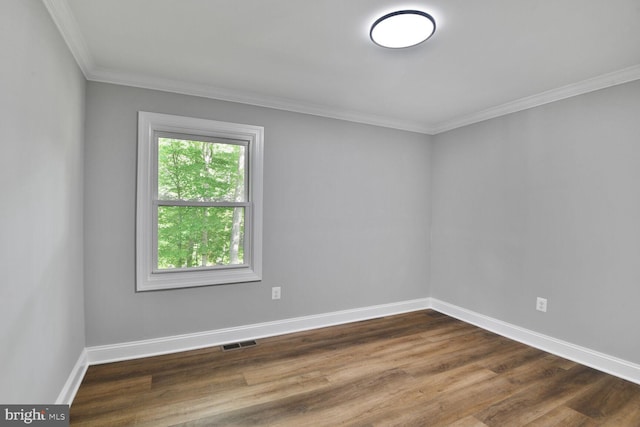 2218 Dairy Farm Rd, Gambrills, MD 21054 - empty room featuring dark wood-type flooring, baseboards, and crown molding