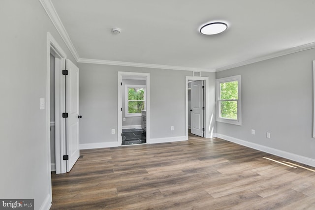 2218 Dairy Farm Rd, Gambrills, MD 21054 - unfurnished bedroom with multiple windows, baseboards, ornamental molding, wood finished floors, and ensuite bathroom