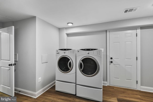 2218 Dairy Farm Rd, Gambrills, MD 21054 - washroom featuring washing machine and clothes dryer, dark wood-type flooring, and baseboards