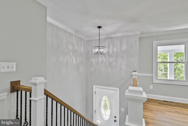 2218 Dairy Farm Rd, Gambrills, MD 21054 - entryway with wood finished floors, ornamental molding, a chandelier, and baseboards