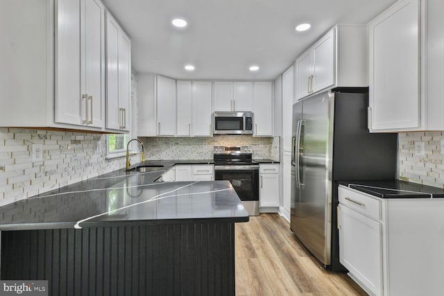 2218 Dairy Farm Rd, Gambrills, MD 21054 - kitchen with stainless steel appliances, a sink, white cabinetry, tasteful backsplash, and recessed lighting