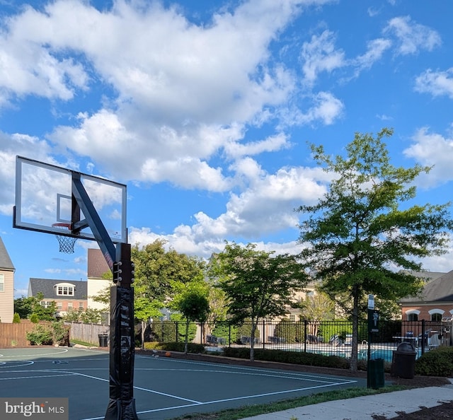 view of basketball court with fence and community basketball court