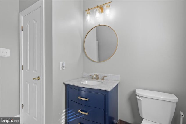 half bath with toilet and vanity