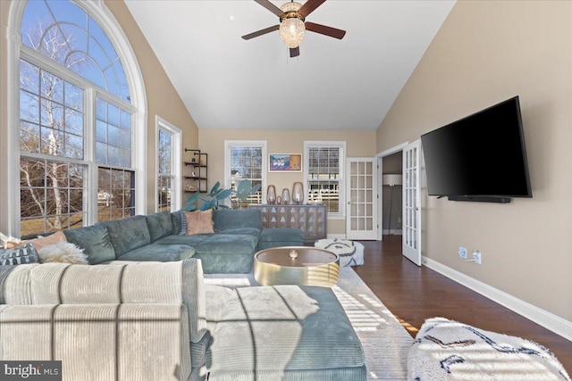 living room with french doors, ceiling fan, baseboards, wood finished floors, and high vaulted ceiling