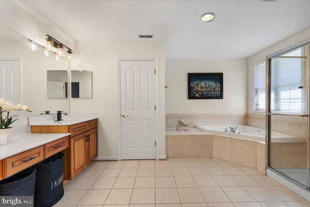 full bathroom with tile patterned floors, a bath, vanity, and recessed lighting