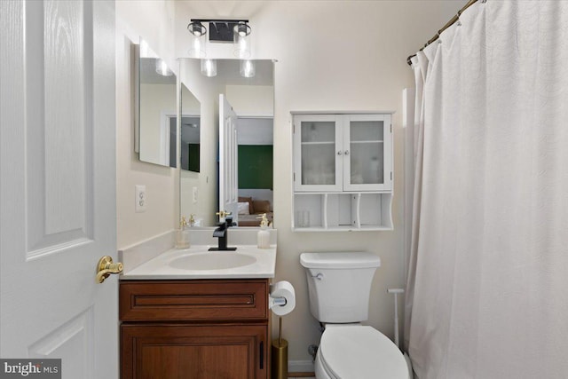 full bath featuring toilet and vanity