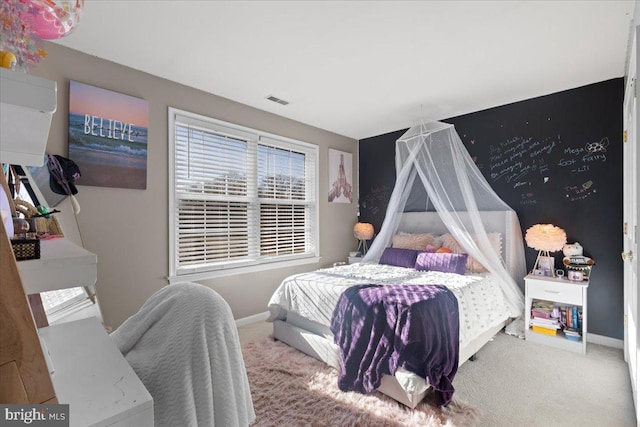 bedroom featuring carpet floors and baseboards