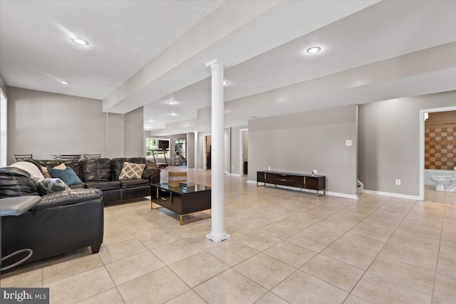 living room featuring light tile patterned floors, recessed lighting, and baseboards