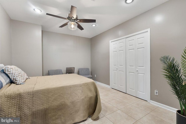 bedroom with baseboards, light tile patterned flooring, recessed lighting, a closet, and ceiling fan