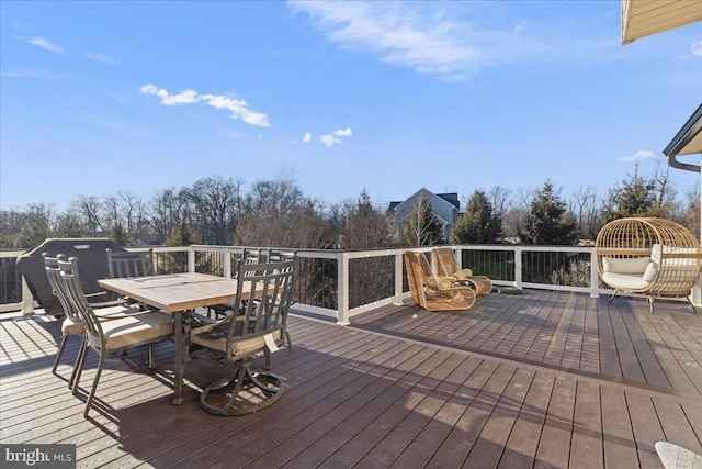 wooden deck with outdoor dining area