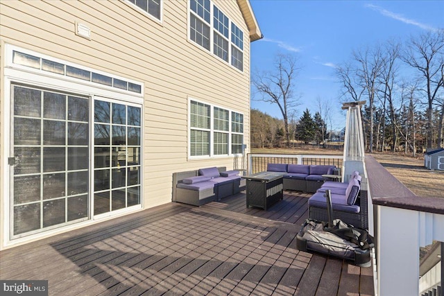 wooden terrace featuring an outdoor living space