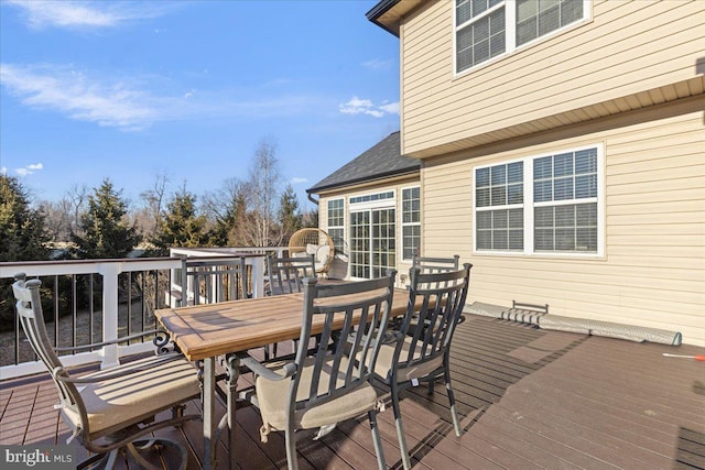 wooden terrace with outdoor dining area