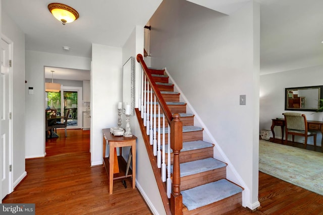 16068 Hayes Ln, Woodbridge, VA 22191 - stairway with wood finished floors and baseboards