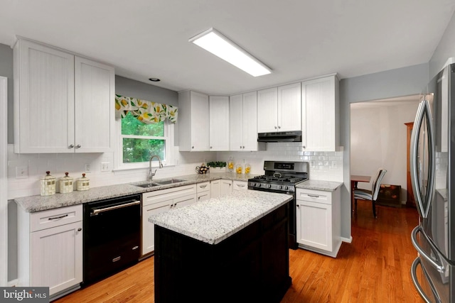 16068 Hayes Ln, Woodbridge, VA 22191 - kitchen with appliances with stainless steel finishes, a sink, under cabinet range hood, and white cabinetry