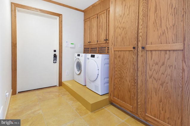 1402 Thurston Rd, Dickerson, MD 20842 - washroom featuring washing machine and clothes dryer, cabinet space, and ornamental molding