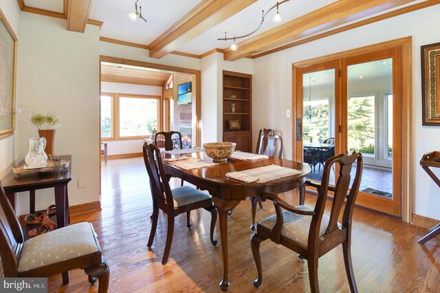 1402 Thurston Rd, Dickerson, MD 20842 - dining area with wood finished floors, beam ceiling, baseboards, and ornamental molding