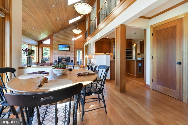 1402 Thurston Rd, Dickerson, MD 20842 - dining room featuring a fireplace, light wood finished floors, high vaulted ceiling, recessed lighting, and wood ceiling