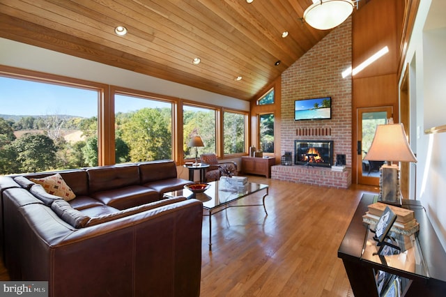 1402 Thurston Rd, Dickerson, MD 20842 - living room with wood finished floors, plenty of natural light, a fireplace, high vaulted ceiling, and wood ceiling